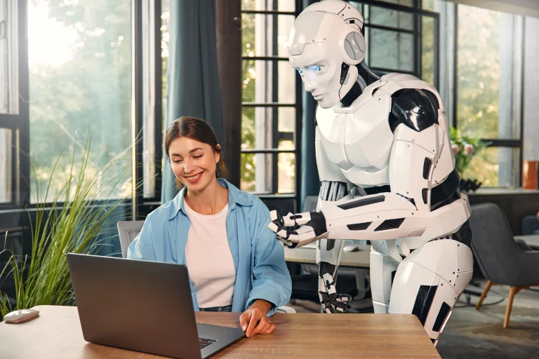 robot-and-woman-working-on-laptop-in-office